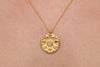 Round Chakra Wheel Gold Necklace with seven stones representing each chakra and a white one in the centre for unity 