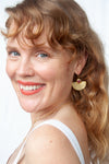 Ruby Crown Half-Moon Earring styled on ear, demonstrating how the gold fan shape frames the face