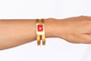 Gold plated bracelet with ruby gemstone. Modern design