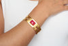 Gold plated bracelet with ruby gemstone. Modern design
