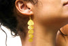 Side profile of cascading gold pebble earrings showing length and movement