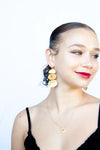 Casey triple-tiered gold earrings worn on model showing natural movement and scale